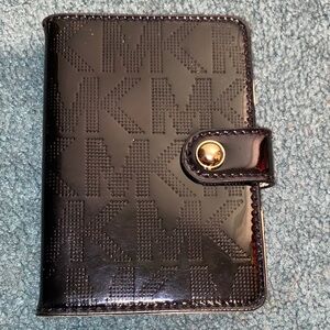 Black Michael Kors Monogram Passport Holder